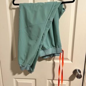 Figs jogger scrubs. Color is Jade. Size Large.